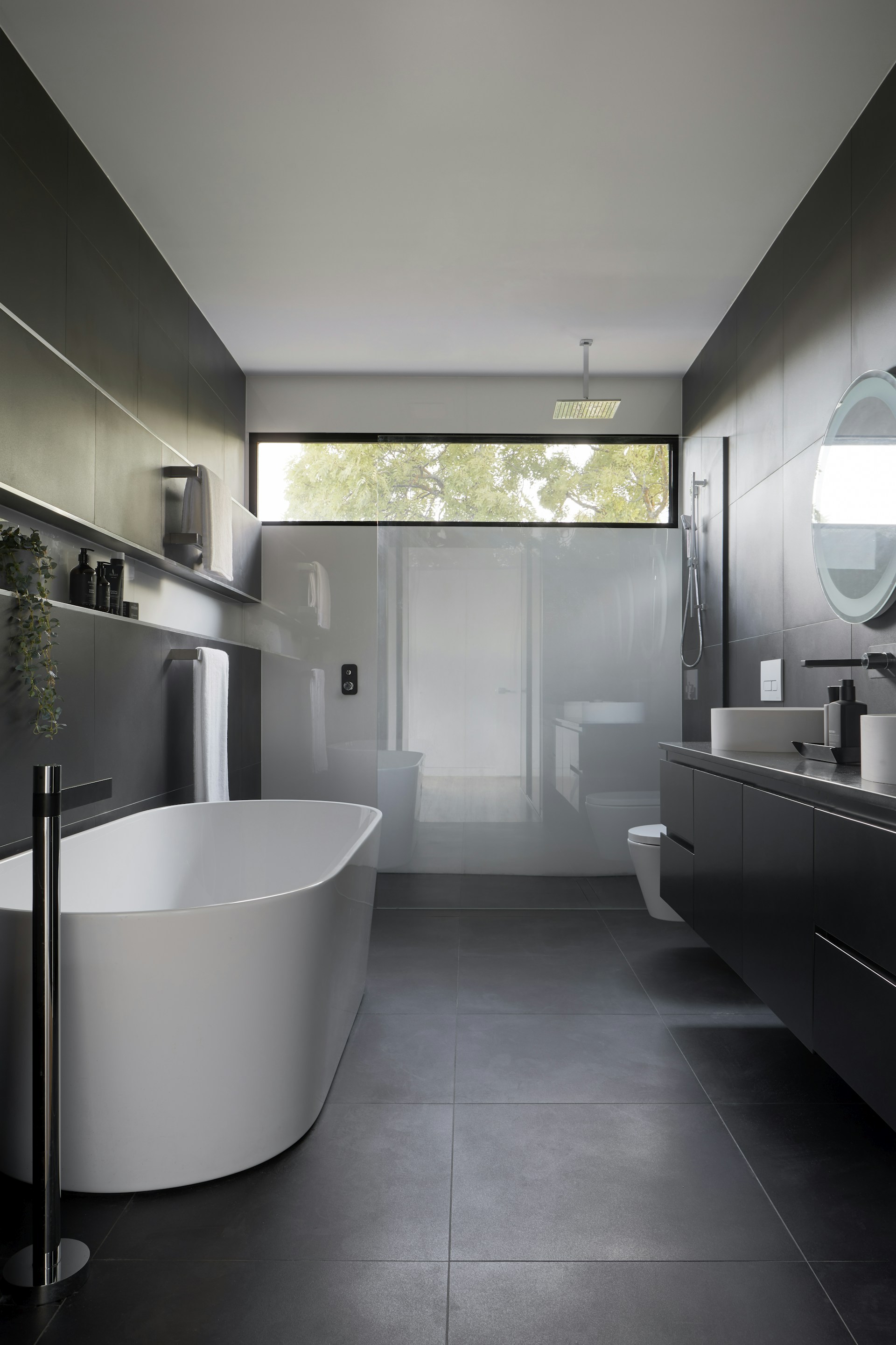 Spa bathroom featuring marble walls